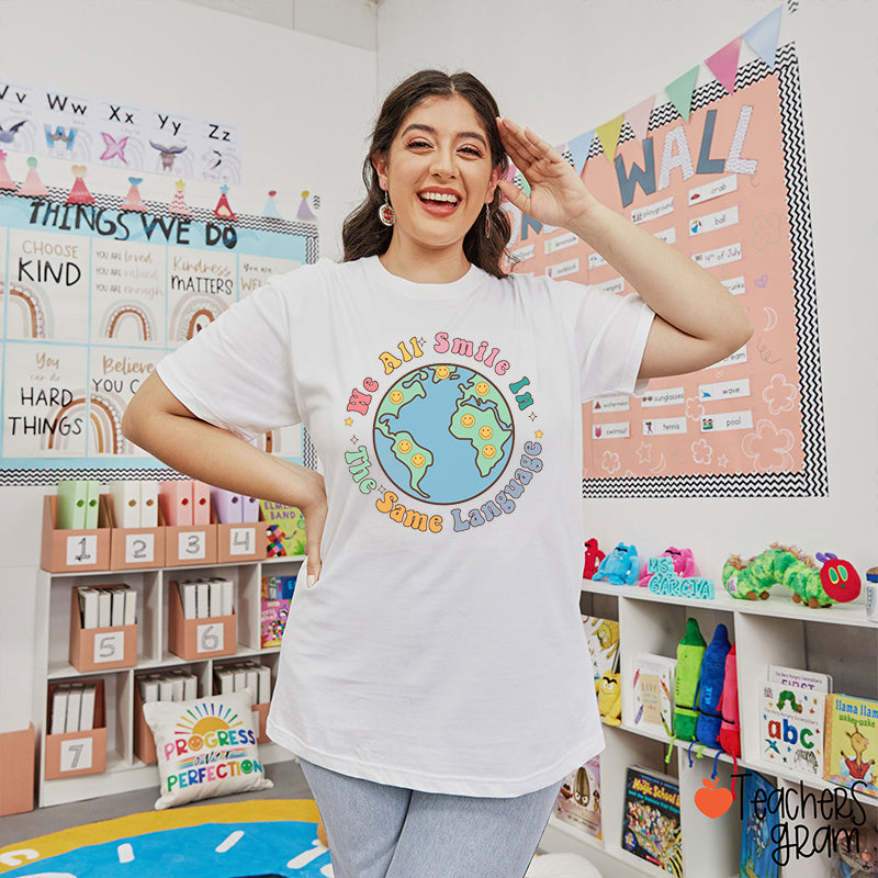 We All Smile In The Same Language Teacher T-Shirt